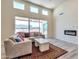 Spacious living room featuring a cozy fireplace and sliding glass doors at 1298 W Calle Tuberia --, Casa Grande, AZ 85194