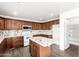 Spacious kitchen with granite countertops, island, and ample cabinetry at 3019 E Denim Trl, San Tan Valley, AZ 85143