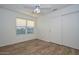 Bright bedroom with wood-look floors and window at 3061 N Platina Cir # N, Mesa, AZ 85215