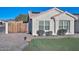 One-story house with a wooden fence and artificial turf at 3061 N Platina Cir # N, Mesa, AZ 85215