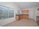 Kitchen with light wood cabinets, granite countertops, and stainless steel appliances at 3061 N Platina Cir # N, Mesa, AZ 85215