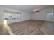 Spacious living area with wood-look floors, view of the pool at 3061 N Platina Cir # N, Mesa, AZ 85215