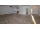 Bright living room features wood-look floors and a high ceiling at 3061 N Platina Cir # N, Mesa, AZ 85215
