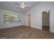 Main bedroom with wood-look floors and pool view at 3061 N Platina Cir # N, Mesa, AZ 85215