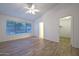 Main bedroom with wood-look floors and pool view at 3061 N Platina Cir # N, Mesa, AZ 85215