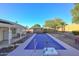 Relaxing rectangular pool with a pool cover and a storage shed in the background at 3061 N Platina Cir # N, Mesa, AZ 85215