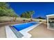 Inviting rectangular pool with a spa and a covered patio area at 3061 N Platina Cir # N, Mesa, AZ 85215