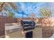 Built-in BBQ area in the backyard, perfect for outdoor cooking at 322 E Caribbean Dr, Casa Grande, AZ 85122