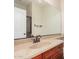 Bathroom with vanity, sink, and large mirror at 322 E Caribbean Dr, Casa Grande, AZ 85122