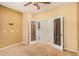 Spacious bedroom with carpeted floor and ceiling fan at 322 E Caribbean Dr, Casa Grande, AZ 85122