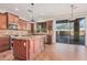 Island kitchen with granite countertops, stainless steel appliances, and hardwood floors at 322 E Caribbean Dr, Casa Grande, AZ 85122