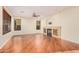Living room with hardwood floors, fireplace, and large windows at 322 E Caribbean Dr, Casa Grande, AZ 85122