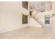 Spacious living room with high ceilings, hardwood floors, and a grand staircase at 322 E Caribbean Dr, Casa Grande, AZ 85122