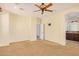 Main bedroom with access to bathroom and carpet flooring at 322 E Caribbean Dr, Casa Grande, AZ 85122