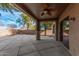 Covered patio with ceiling fan, providing a shaded outdoor space at 322 E Caribbean Dr, Casa Grande, AZ 85122
