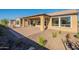 Landscaped backyard with a patio and gravel at 389 E Bracciano Ave, Queen Creek, AZ 85140