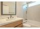 Bathroom with tub, single vanity, and window at 389 E Bracciano Ave, Queen Creek, AZ 85140