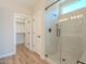 Bathroom with a glass shower and walk-in closet at 389 E Bracciano Ave, Queen Creek, AZ 85140