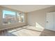 Bright bedroom with large windows and wood-look flooring at 389 E Bracciano Ave, Queen Creek, AZ 85140