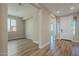 Bright and airy entryway with hardwood floors and access to other rooms at 389 E Bracciano Ave, Queen Creek, AZ 85140