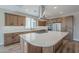 Modern kitchen with light wood cabinets, a large island, and stainless steel appliances at 389 E Bracciano Ave, Queen Creek, AZ 85140