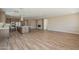 Open concept kitchen with island and Gathering room view at 389 E Bracciano Ave, Queen Creek, AZ 85140