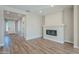 Living area with a built-in fireplace and hardwood floors at 389 E Bracciano Ave, Queen Creek, AZ 85140