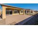 Spacious backyard patio with adjacent grass area at 389 E Bracciano Ave, Queen Creek, AZ 85140