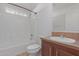 Clean bathroom with tub, toilet, and wood vanity at 5201 W Camelback Rd # A187, Phoenix, AZ 85031
