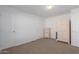 Bedroom with neutral carpeting and plenty of closet space at 5201 W Camelback Rd # A187, Phoenix, AZ 85031