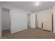 Bright bedroom with neutral carpeting and built-in wardrobe at 5201 W Camelback Rd # A187, Phoenix, AZ 85031