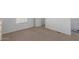 Spacious bedroom with neutral carpeting and ample closet space at 5201 W Camelback Rd # A187, Phoenix, AZ 85031