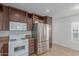 Updated kitchen, featuring stainless steel appliances and wood cabinets at 5201 W Camelback Rd # A187, Phoenix, AZ 85031