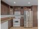 Modern kitchen with stainless steel appliances and ample cabinetry at 5201 W Camelback Rd # A187, Phoenix, AZ 85031