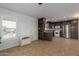 Kitchen with dark brown cabinets, stainless steel appliances, and tile flooring at 5201 W Camelback Rd # A187, Phoenix, AZ 85031
