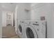 Laundry room with LG washer and dryer, and overhead shelving at 5201 W Camelback Rd # A187, Phoenix, AZ 85031