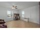 Living room with tile flooring, leather recliner, and built-in shelving at 5201 W Camelback Rd # A187, Phoenix, AZ 85031
