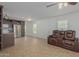 Open floor plan with kitchen, living room, and tile flooring at 5201 W Camelback Rd # A187, Phoenix, AZ 85031