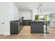 Modern bar with dark cabinetry, quartz countertops, and wine cooler at 6862 E Joshua Tree Ln, Paradise Valley, AZ 85253