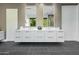 Bathroom with floating double vanity and modern fixtures at 6862 E Joshua Tree Ln, Paradise Valley, AZ 85253