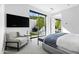 Bright bedroom with sliding glass doors to backyard at 6862 E Joshua Tree Ln, Paradise Valley, AZ 85253