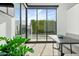 Breakfast nook with built-in banquette and sliding glass doors to backyard at 6862 E Joshua Tree Ln, Paradise Valley, AZ 85253