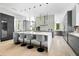 Modern kitchen with expansive island, stainless steel appliances, and white and gray cabinetry at 6862 E Joshua Tree Ln, Paradise Valley, AZ 85253