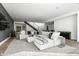 Spacious living area with sectional sofa and modern staircase at 6862 E Joshua Tree Ln, Paradise Valley, AZ 85253