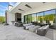 Modern outdoor kitchen and lounge area with sleek design at 6862 E Joshua Tree Ln, Paradise Valley, AZ 85253