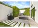 Private patio with seating and lush landscaping at 6862 E Joshua Tree Ln, Paradise Valley, AZ 85253