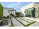 Back patio with water feature, artificial turf, and modern design at 6862 E Joshua Tree Ln, Paradise Valley, AZ 85253