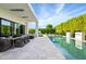Resort-style pool with outdoor dining area at 6862 E Joshua Tree Ln, Paradise Valley, AZ 85253