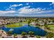 Aerial view of community with lake, golf course, and homes at 8257 E Dutchman Dr, Mesa, AZ 85208