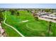 Aerial view of community, golf course, and residential homes at 8257 E Dutchman Dr, Mesa, AZ 85208